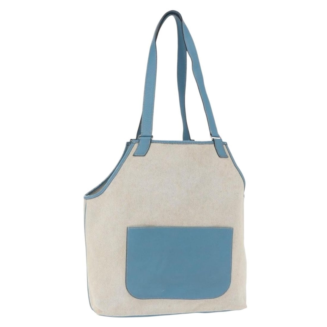 Gray Canvas Hermes Tote Bag Silver Tone Details Made in France: Gray Canvas Hermes Tote Bag Silver Tone Details Made in France This Hermes tote bag is crafted from gray and silver canvas and features a spacious design. Made in France, the bag shows significant sig