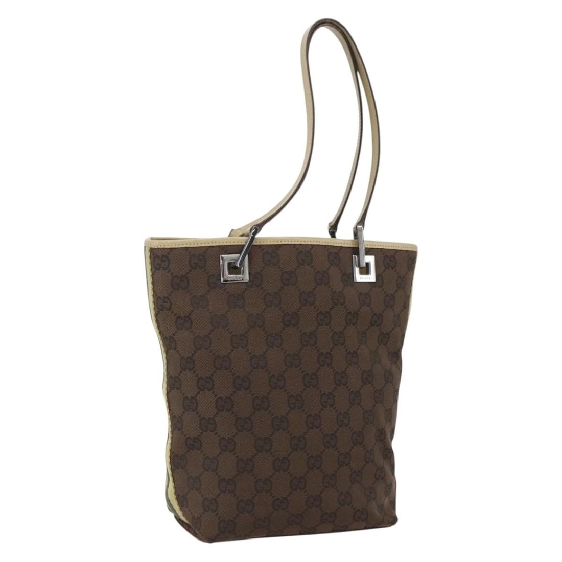 Beige Silver GG Canvas Tote by Gucci Model 31244 Italy: Beige Silver GG Canvas Tote by Gucci Model 31244 Italy This is a Gucci GG Canvas tote bag in beige and silver tones. Crafted in Italy, it features the iconic GG canvas exterior and a spacious interior