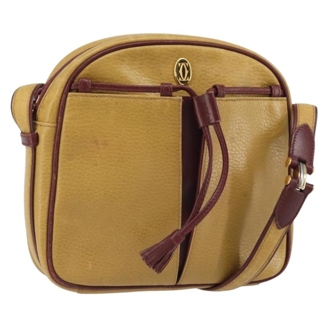 Must Line Yellow Leather Shoulder Bag by Cartier: Must Line Yellow Leather Shoulder Bag by Cartier This is a Cartier Must Line shoulder bag crafted from yellow and gold-toned leather. The bag is made in Spain and features a compact design with an adj