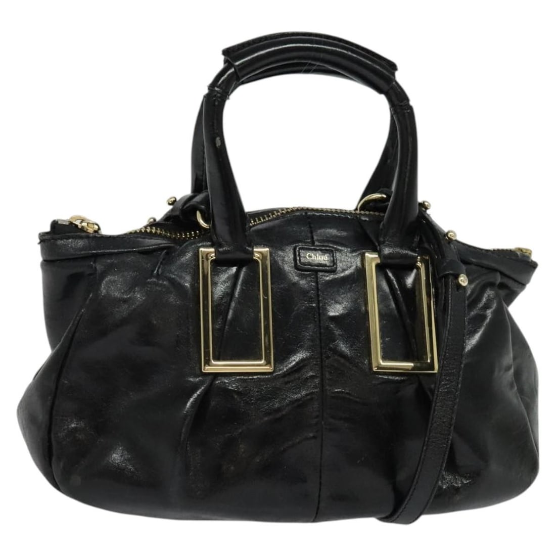 Chloe Etel Black Leather Two Way Handbag with Gold Accents: Chloe Etel Black Leather Two Way Handbag with Gold Accents This Chloe Etel 2-way handbag features a black leather exterior with gold-tone accents. Designed for versatile use, it can be carried as a ha