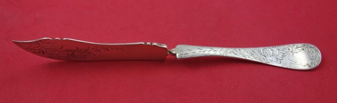 Towle Sterling Silver Master Butter Knife Number 38 Engraved 7 1/4": Towle Sterling Silver Master Butter Knife Number 38 Engraved 7 1/4" This exquisite master butter knife features a bright cut blade and a twisted design, measuring 7 1/4" in length. Crafted by Towle, t