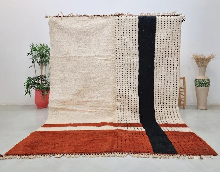 Authentic Handmade Moroccan Wool Rug 8 x 5 Feet: Authentic Handmade Moroccan Wool Rug 8 x 5 Feet This Authentic Handmade Wool Rug is a stunning piece crafted in the Atlas Mountains by skilled local Berber women weavers. Utilizing traditional tools