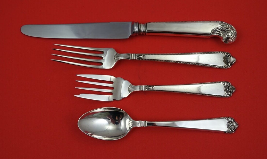 Birks George II Plain Sterling Silver 4-Piece Place Setting: Birks George II Plain Sterling Silver 4-Piece Place Setting Enhance your dining experience with this exquisite 4-piece place setting from the George II Plain pattern by Birks, crafted in sterling silv