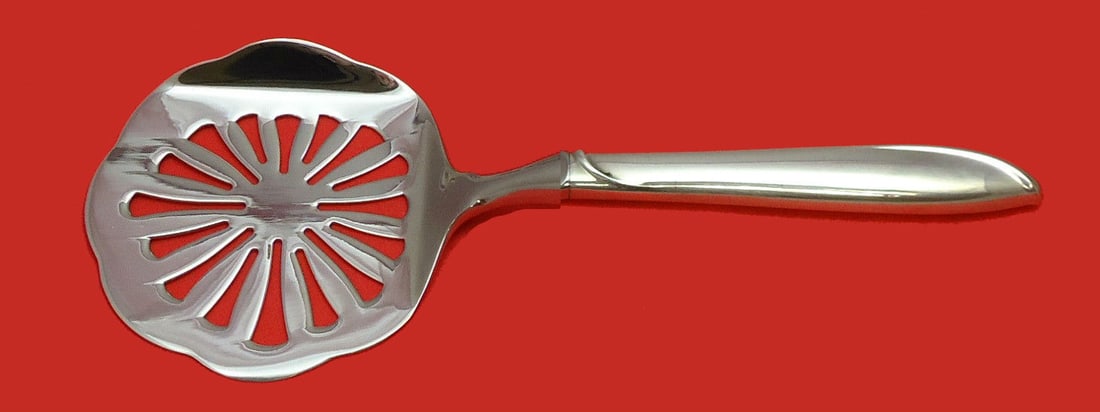 Custom Made Silver Rhythm Tomato Server by International Sterling: Custom Made Silver Rhythm Tomato Server by International Sterling Introducing the Silver Rhythm Tomato Server, crafted by International Sterling. This exquisite piece features a hollow handle made of