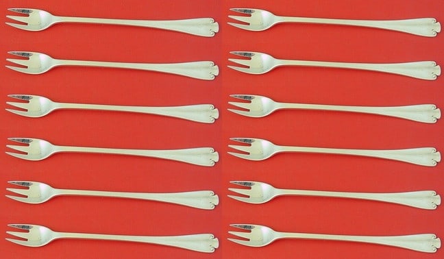 Tiffany & Co Flemish Sterling Silver Cocktail Forks Set of 12: Tiffany & Co Flemish Sterling Silver Cocktail Forks Set of 12 This exquisite set of 12 cocktail forks by Tiffany & Co. features the elegant Flemish pattern, crafted from high-quality sterling silver.