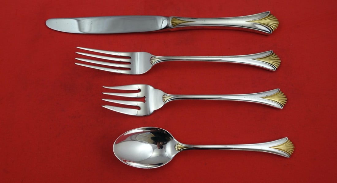 Lunt Regency Shell Gold Sterling Silver 4-Pc Place Setting: Lunt Regency Shell Gold Sterling Silver 4-Pc Place Setting Enhance your dining experience with this exquisite Regency Shell Gold place setting by Lunt, crafted from high-quality sterling silver. This