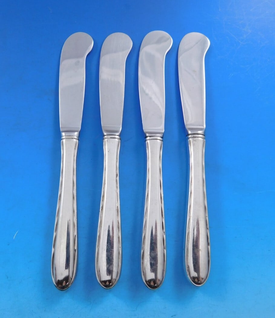 Towle Sterling Silver Silver Flutes Butter Spreader Set of 4: Towle Sterling Silver Silver Flutes Butter Spreader Set of 4 Enhance your dining experience with this exquisite set of four butter spreaders from the Silver Flutes pattern by Towle. Crafted from high-
