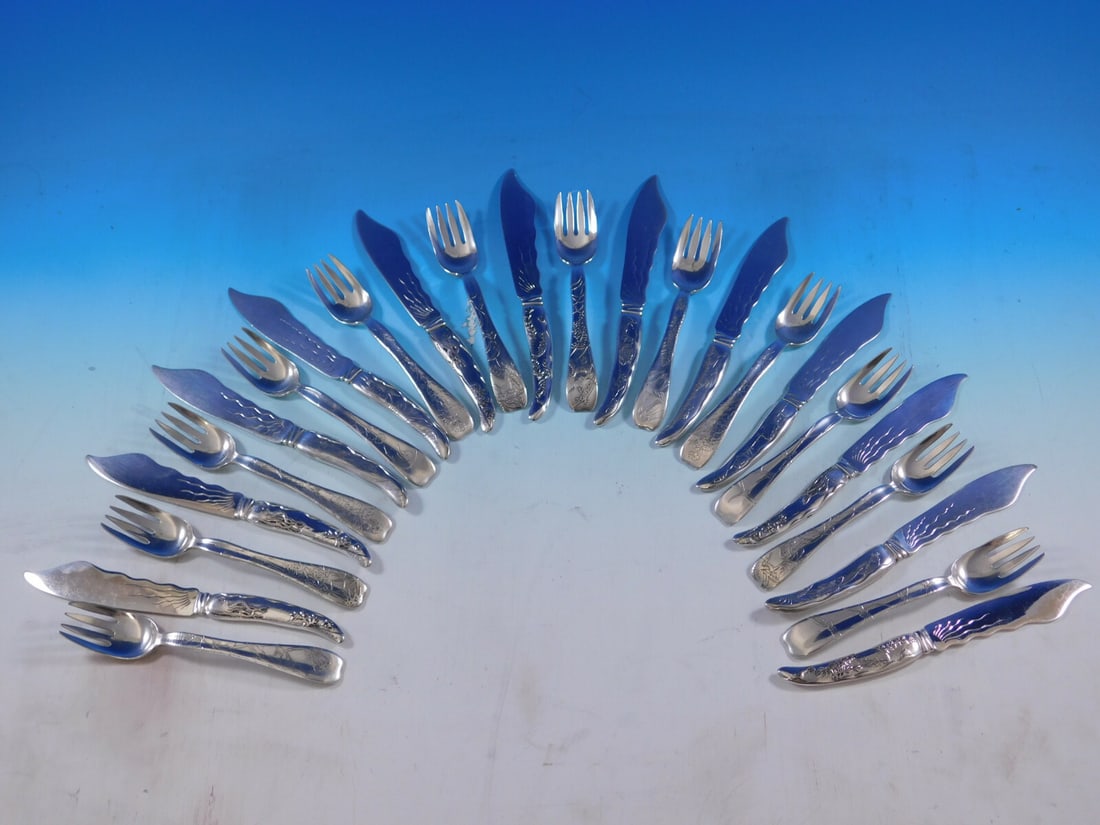 Tiffany & Co. Lap Over Edge Sterling 24Pc Fish Set with Acid Etched Birds: Tiffany & Co. Lap Over Edge Sterling 24Pc Fish Set with Acid Etched Birds Discover the elegance of this rare and beautiful 24-piece individual fish set by Tiffany & Co., crafted between 1880-1899. Thi