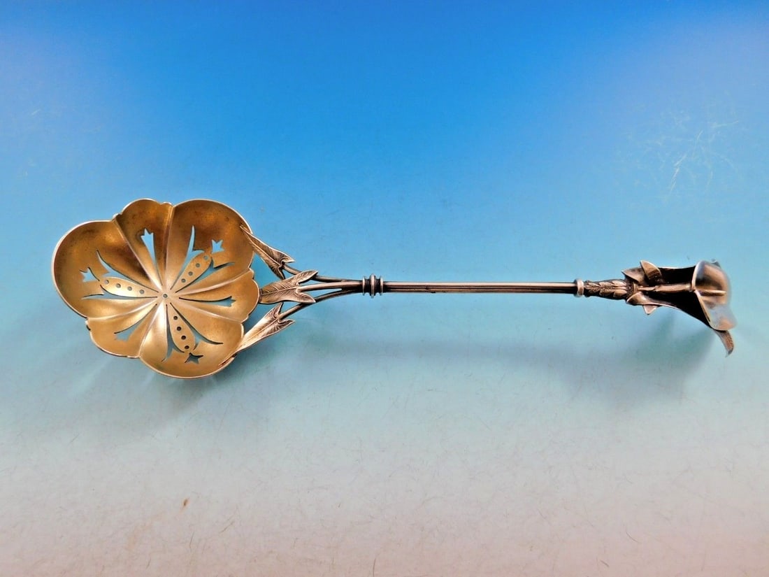 Whiting Calla Lily Sterling Silver Sugar Sifter Gold Washed 8 3/8": Whiting Calla Lily Sterling Silver Sugar Sifter Gold Washed 8 3/8" Introducing the exquisite Calla Lily Sterling Silver Sugar Sifter by Whiting, a remarkable serving piece dating back to the 1850-1899