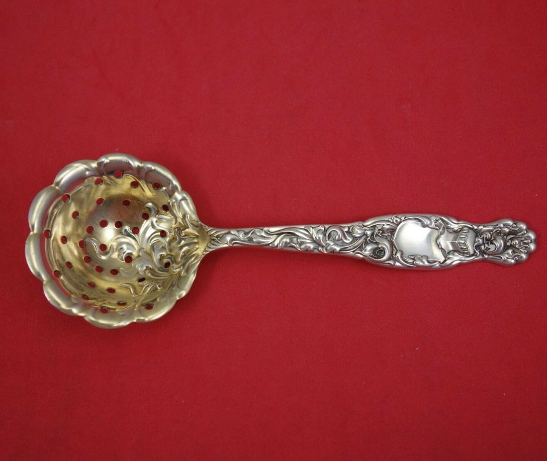 Whiting Heraldic Sterling Silver Sugar Sifter Gold Wash 5 5/8": Whiting Heraldic Sterling Silver Sugar Sifter Gold Wash 5 5/8" This exquisite sugar sifter from the Heraldic pattern by Whiting is crafted from sterling silver and features a gold wash finish. Measuri