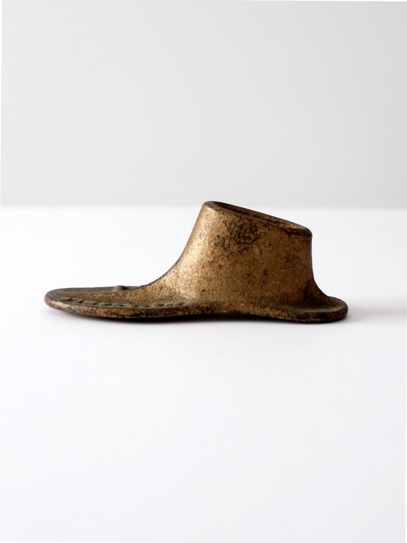 Late 19th Century Cast Iron Shoe Last with Brass Tone Finish: Late 19th Century Cast Iron Shoe Last with Brass Tone Finish This antique cast iron cobbler shoe form dates from the late 19th to early 20th century. It features a compact design with a stamped size d
