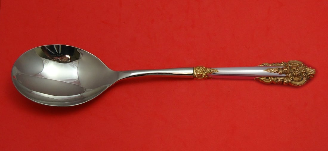 Wallace Grande Baroque Casserole Spoon Sterling Silver Gold Accent 11 3/4": Wallace Grande Baroque Casserole Spoon Sterling Silver Gold Accent 11 3/4" This exquisite casserole spoon, crafted by Wallace, features the elegant Grande Baroque pattern with a stunning gold accent.