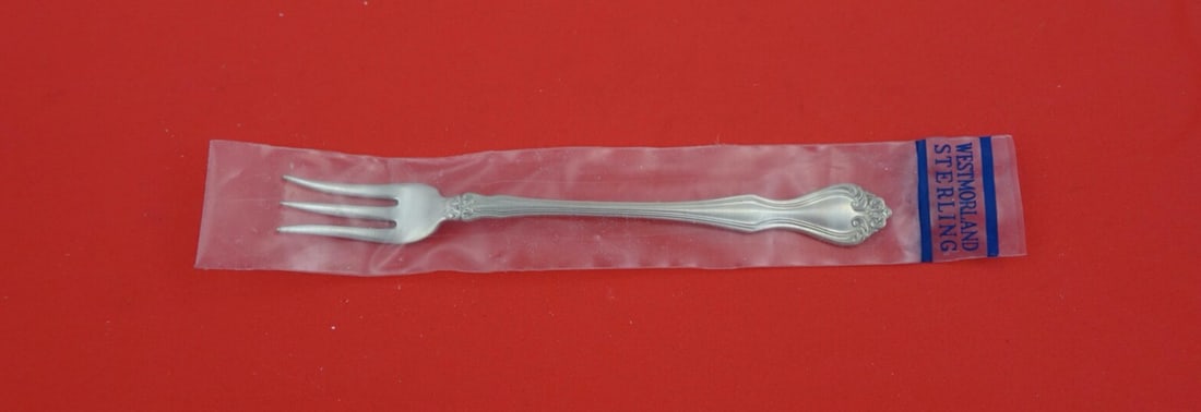 Westmorland Sterling Silver Cocktail Fork George and Martha 5 5/8": Westmorland Sterling Silver Cocktail Fork George and Martha 5 5/8" This exquisite cocktail fork from the George and Martha pattern by Westmorland is crafted from high-quality sterling silver. Measurin