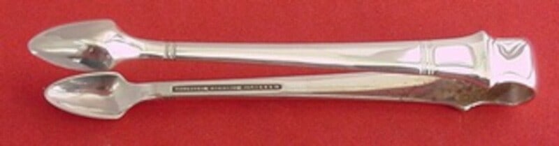 Tiffany & Co. Windham Sterling Silver Sugar Tong 4 1/4": Tiffany & Co. Windham Sterling Silver Sugar Tong 4 1/4" Introducing the Windham Sterling Silver Sugar Tong by Tiffany & Co., measuring 4 1/4". This exquisite serving piece showcases the elegant Windha