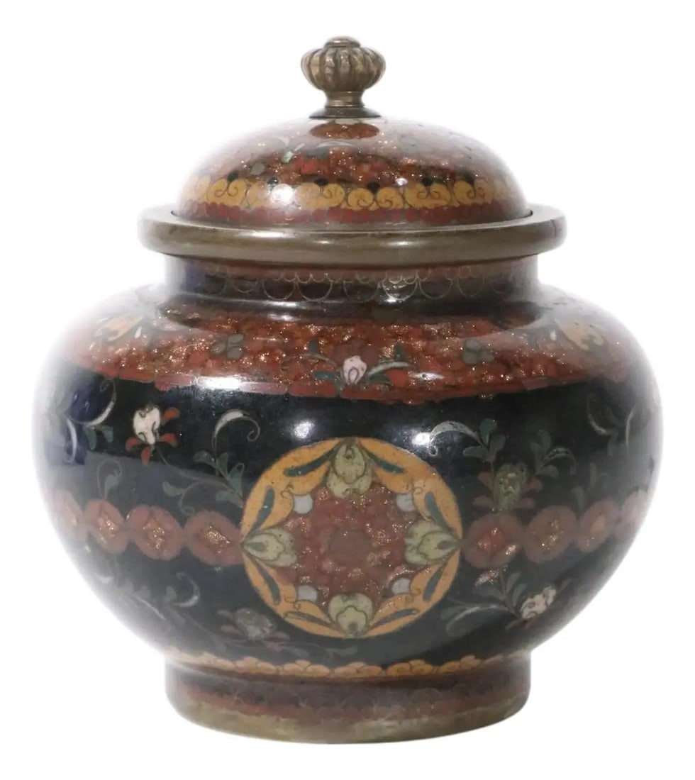 Meiji Period Japanese Cloisonne Covered Jar Black 3x3.5: Meiji Period Japanese Cloisonne Covered Jar Black 3x3.5 This exquisite Japanese cloisonne covered jar is a charming piece from the Meiji period (1868 - 1912). It features a sleek black finish and is i
