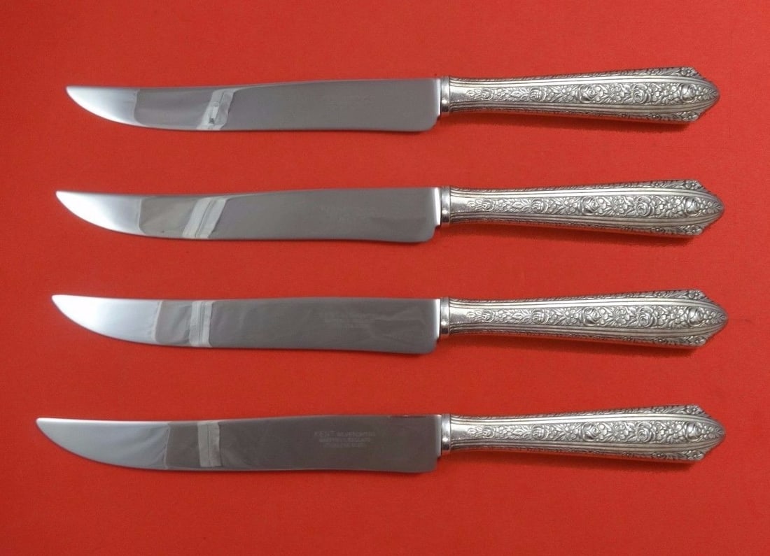 Normandie by Wallace 4pc Sterling Silver Texas Steak Knife Set: Normandie by Wallace 4pc Sterling Silver Texas Steak Knife Set Elevate your dining experience with the Normandie by Wallace Sterling Silver Steak Knife Set. This impressive 4-piece set features a clas