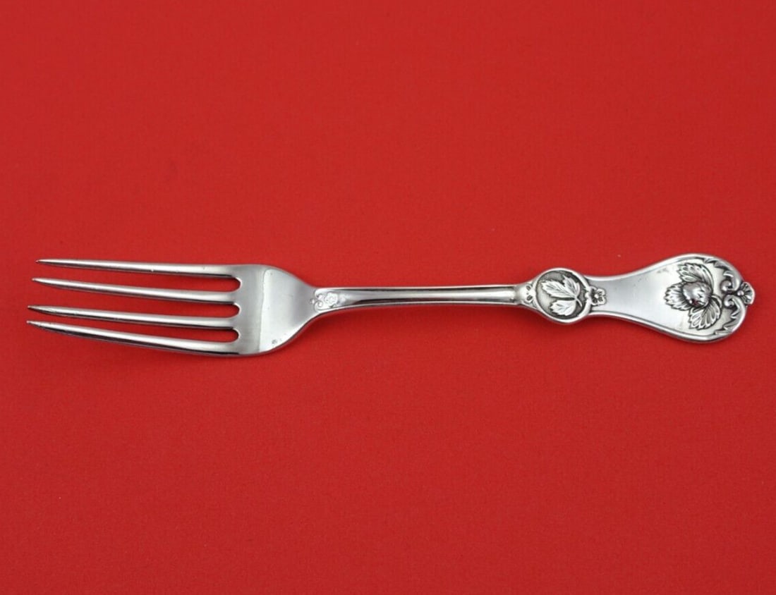 Durgin Strawberry Coin Silver Tea Fork 6 Inch Monogrammed: Durgin Strawberry Coin Silver Tea Fork 6 Inch Monogrammed Experience the elegance of the Strawberry pattern by Durgin with this exquisite coin silver tea fork. Measuring 6 inches, this fork showcases