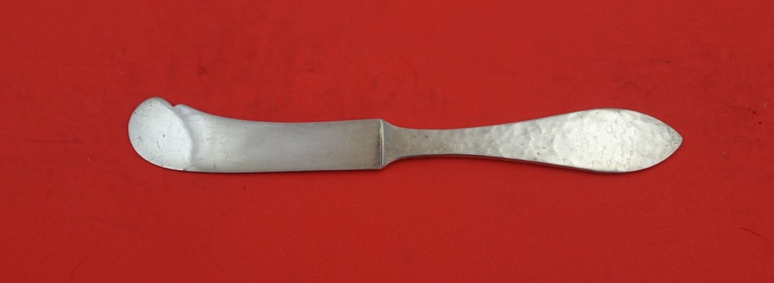 Shreve Antique Hammered Sterling Silver Butter Spreader 5 3/4": Shreve Antique Hammered Sterling Silver Butter Spreader 5 3/4" This exquisite butter spreader features a flat handle design and is crafted from high-quality sterling silver. The piece showcases the An