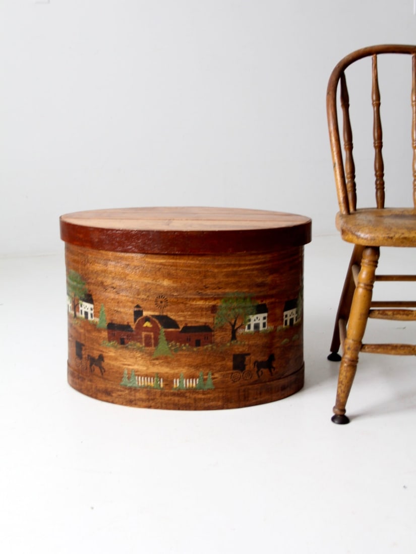 Rare Vintage Hand-Painted Wooden Bandbox with Farmhouse Scene: Rare Vintage Hand-Painted Wooden Bandbox with Farmhouse Scene This vintage wooden bandbox is a rare find, showcasing a charming hand-painted farmhouse scene with barn red trim on the lid. Its generous
