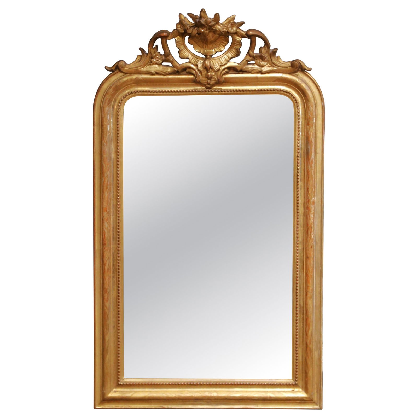 French Louis Philippe Giltwood Mirror With Floral Crest Circa 1870: French Louis Philippe Giltwood Mirror With Floral Crest Circa 1870 This mid-19th century French Louis Philippe mirror is crafted from richly carved giltwood with a refined cartouche crest. The rectang