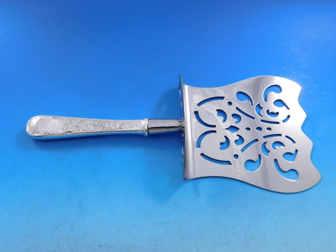 Kirk Old Maryland Engraved Sterling Silver Asparagus Server 8 7/8": Kirk Old Maryland Engraved Sterling Silver Asparagus Server 8 7/8" This exquisite asparagus server is a fine example of craftsmanship by Kirk, featuring the elegant Old Maryland Engraved pattern. Made