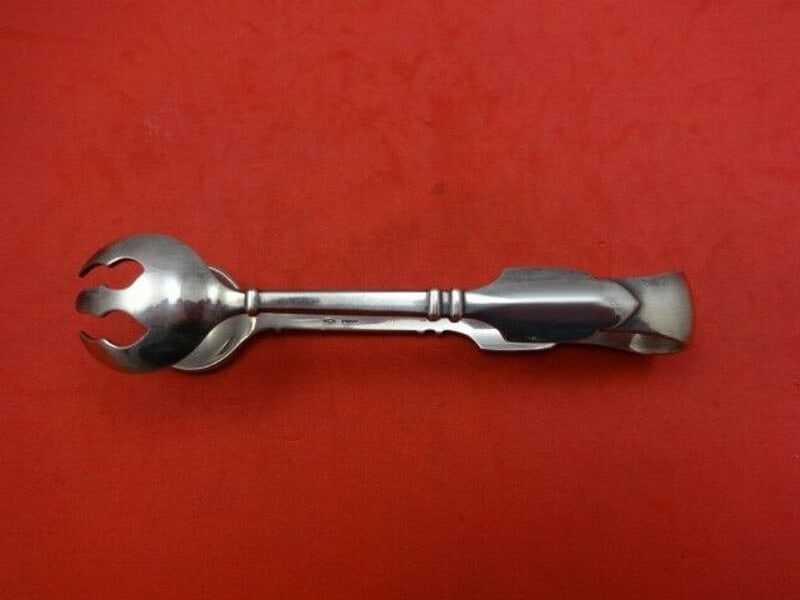 Graff W and D Robert Bruce Sterling Silver 5 Inch Sugar Tongs: Graff W and D Robert Bruce Sterling Silver 5 Inch Sugar Tongs This exquisite pair of sugar tongs is part of the Robert Bruce pattern by Graff W and D, crafted from high-quality sterling silver. Measur