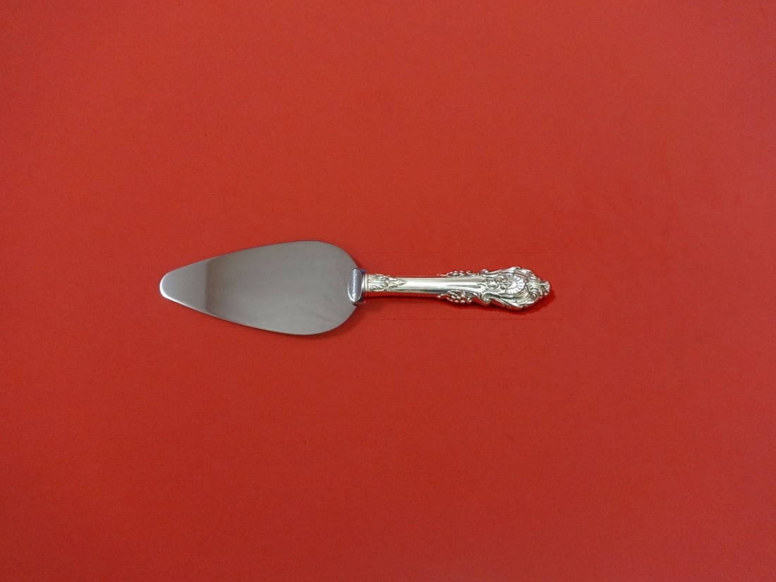 Wallace Sir Christopher Sterling Silver Custom Cheese Server 6": Wallace Sir Christopher Sterling Silver Custom Cheese Server 6" This exquisite cheese server from the Sir Christopher pattern by Wallace combines elegance and functionality. Made from sterling silver
