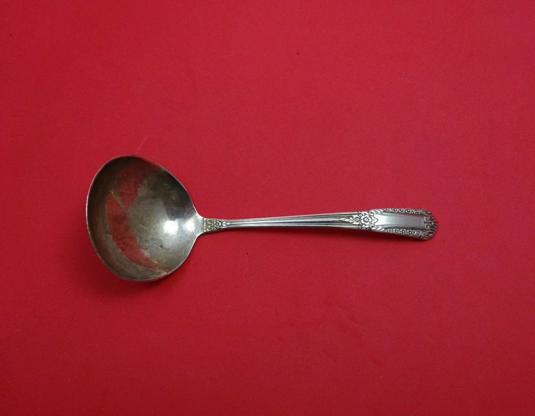 State House Inaugural Sterling Silver Gravy Ladle 6.5": State House Inaugural Sterling Silver Gravy Ladle 6.5" Elevate your dining experience with this exquisite Sterling Silver Gravy Ladle from the prestigious Inaugural pattern by State House. Measuring 6