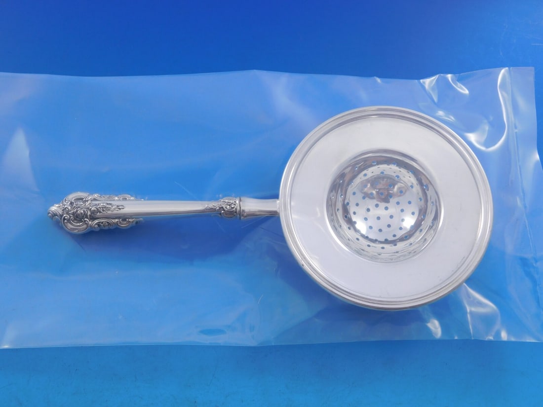 Wallace Grande Baroque Sterling Silver Custom Tea Strainer: Wallace Grande Baroque Sterling Silver Custom Tea Strainer This exquisite Grande Baroque tea strainer by Wallace showcases a stunning design, featuring a sterling silver hollow handle paired with a si