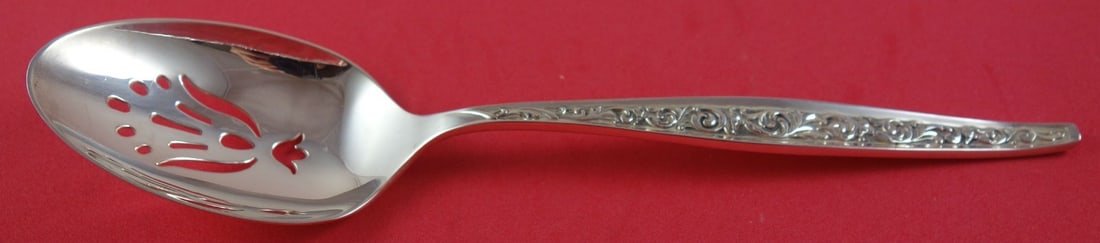 Reed & Barton Renaissance Scroll Sterling Silver Slotted Spoon 8.5": Reed & Barton Renaissance Scroll Sterling Silver Slotted Spoon 8.5" This elegant serving spoon is crafted from high-quality sterling silver and features the exquisite Renaissance pattern by Reed and B