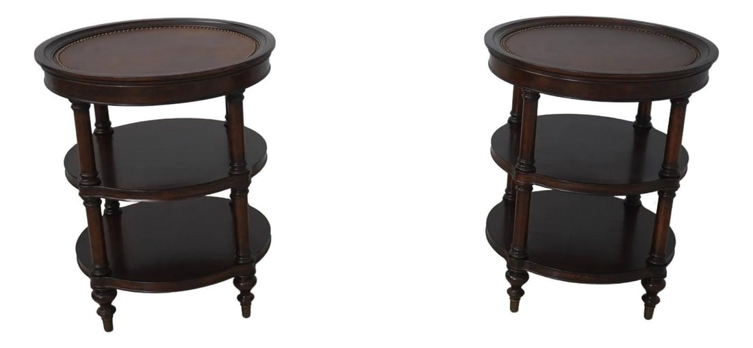 Pair of Distressed Leather Top Occasional Tables with Brass Feet: Pair of Distressed Leather Top Occasional Tables with Brass Feet This exquisite pair of occasional tables features a round leather top with a sophisticated distressed finish, making them a perfect add