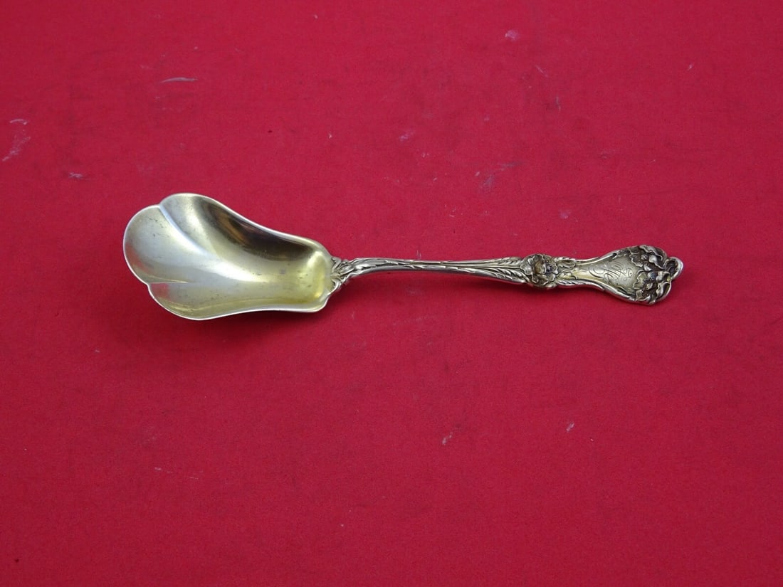 Alvin Majestic Sterling Silver Gold Washed Lobed Sugar Spoon 6": Alvin Majestic Sterling Silver Gold Washed Lobed Sugar Spoon 6" This exquisite 6" sugar spoon is crafted from high-quality sterling silver and features the elegant Majestic pattern by Alvin. The spoon
