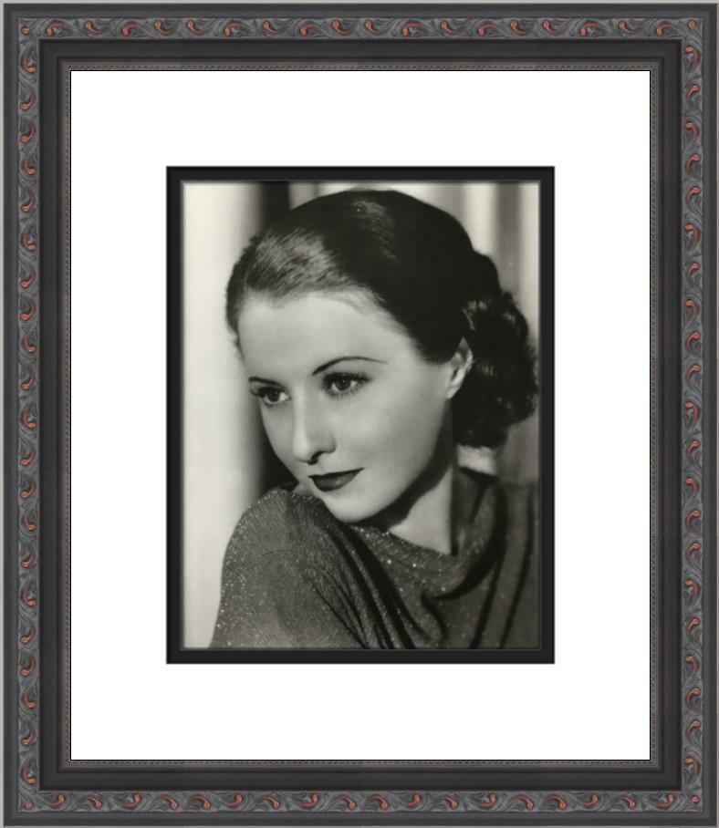 Barbara Stanwyck Black and White Print Custom Framed Artwork: Barbara Stanwyck Black and White Print Custom Framed Artwork This beautifully custom framed reproduction print features the iconic actress Barbara Stanwyck, presented in a classic black and white styl