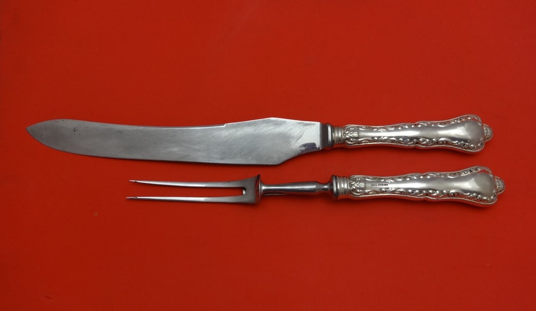 Birks Louis XV Sterling Silver 2pc Roast Carving Set: Birks Louis XV Sterling Silver 2pc Roast Carving Set This exquisite Louis XV by Birks Sterling Silver Roast Carving Set includes a 14 1/8" knife and an 11" fork, both featuring a hollow handle made of