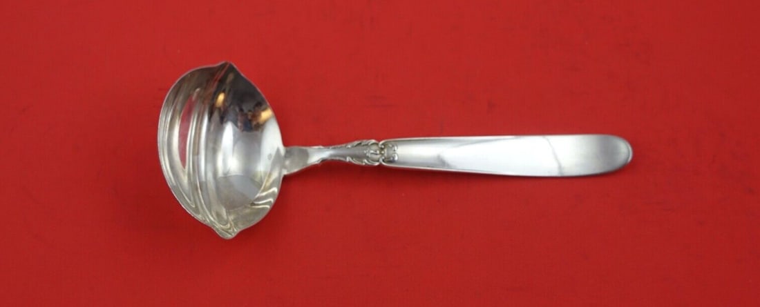 Camusso Portofino Sterling Silver Gravy Ladle with Spouts 7 Inch: Camusso Portofino Sterling Silver Gravy Ladle with Spouts 7 Inch Introducing the exquisite Portofino Gravy Ladle by Camusso, crafted from high-quality sterling silver. This elegant spoon features conv
