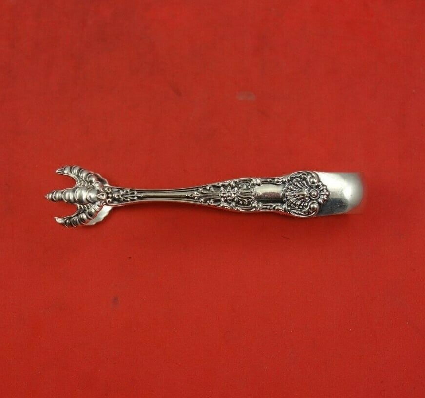 Dominick & Haff New King Sterling Silver Sugar Tong 3 1/8" Serving Piece: Dominick & Haff New King Sterling Silver Sugar Tong 3 1/8" Serving Piece This exquisite sugar tong, crafted by Dominick & Haff, showcases the elegant New King pattern. Made from high-quality sterling