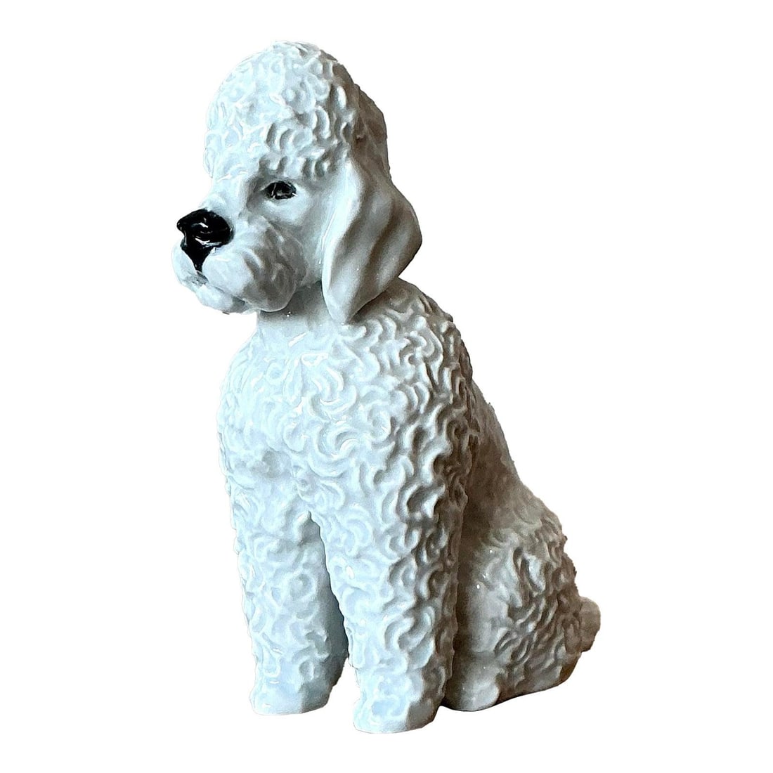 White Porcelain Poodle Figurine With Glazed Finish Hollywood Regency Style: White Porcelain Poodle Figurine With Glazed Finish Hollywood Regency Style This vintage Regency glazed ceramic poodle figurine captures the playful sophistication of mid-century design and Hollywood R