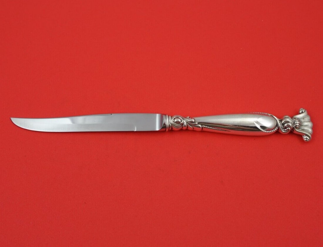 Wallace Romance of the Sea Sterling Silver Steak Knife 9 1/4": Wallace Romance of the Sea Sterling Silver Steak Knife 9 1/4" This exquisite steak knife is part of the "Romance of the Sea" pattern by Wallace. Crafted from high-quality sterling silver, it features