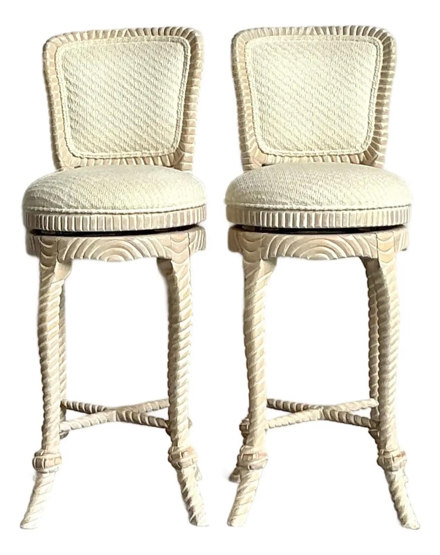 Pair of Rope Carved Hollywood Regency Swivel Barstools With Upholstered Seats: Pair of Rope Carved Hollywood Regency Swivel Barstools With Upholstered Seats This pair of vintage bar stools features intricately carved rope-twist details on the legs and frame, capturing the elegan