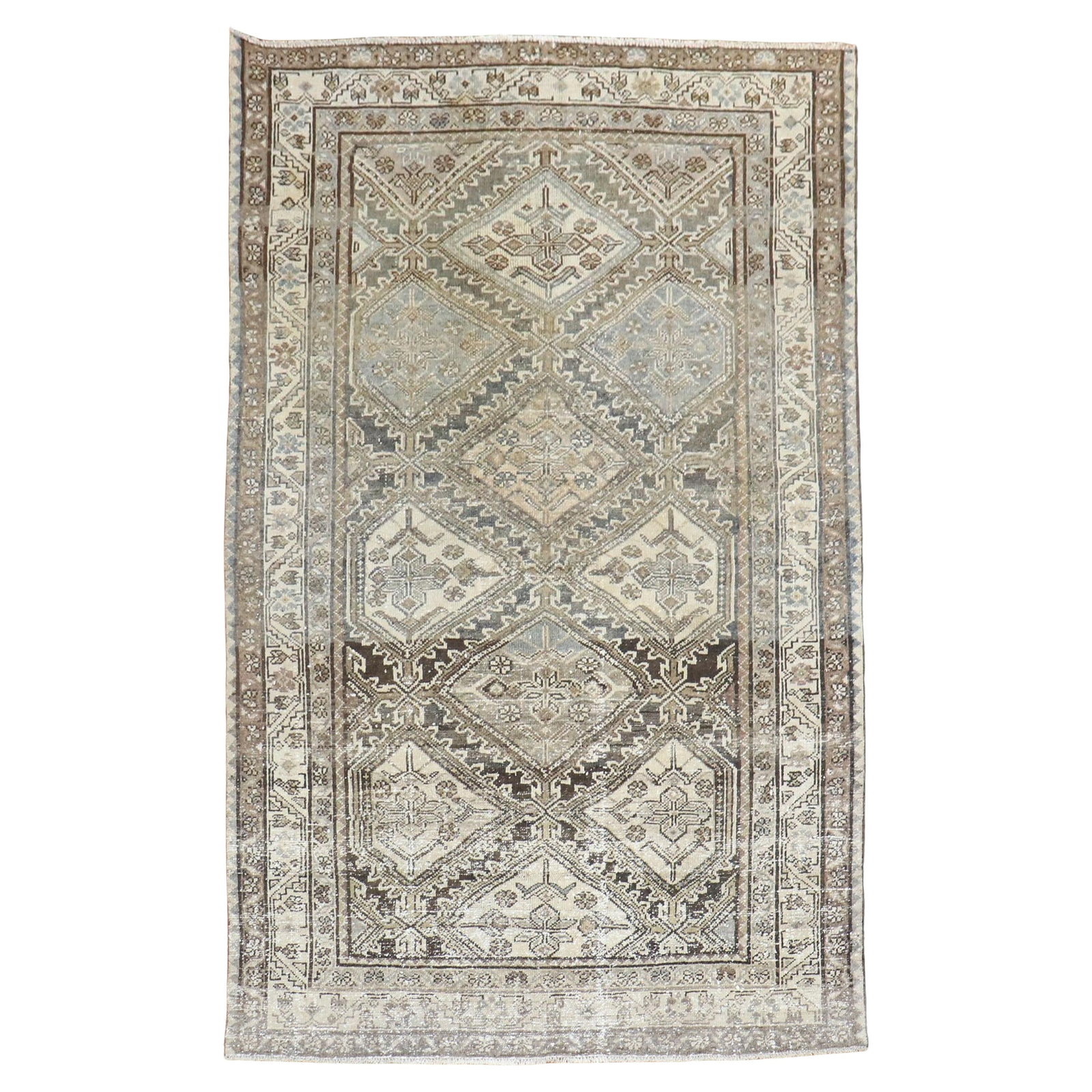Early 20th Century Hand-Knotted Kurd Wool Rug 47 x 75 Inch: Early 20th Century Hand-Knotted Kurd Wool Rug 47 x 75 Inch This geometric antique Kurd rug features a rustic design in shades of brown and charcoal. Hand-knotted from wool, it originates from Iran and