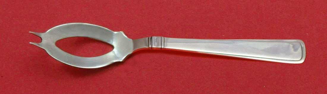 Cohr Olympia Sterling Silver Olive Spoon Custom Made 5 3/8": Cohr Olympia Sterling Silver Olive Spoon Custom Made 5 3/8" This exquisite olive spoon is crafted in sterling silver and features the elegant Olympia pattern by Cohr. Measuring 5 3/8 inches in length,