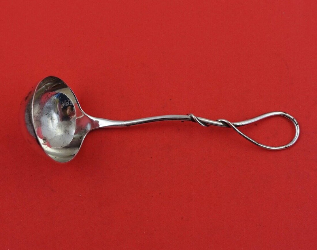 Durgin Sterling Silver 6 Inch Sauce Ladle with Twisted Handle: Durgin Sterling Silver 6 Inch Sauce Ladle with Twisted Handle This exquisite Durgin Sterling Silver Sauce Ladle features a beautifully designed aesthetic twisted loop handle. Measuring 6 inches in len
