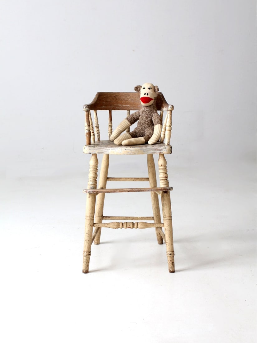Vintage Antique Children's Chair with Spindle Back and Cream Finish: Vintage Antique Children's Chair with Spindle Back and Cream Finish This antique children's chair showcases a charming design with turned legs and a classic "captains" barrel seat featuring a spindle