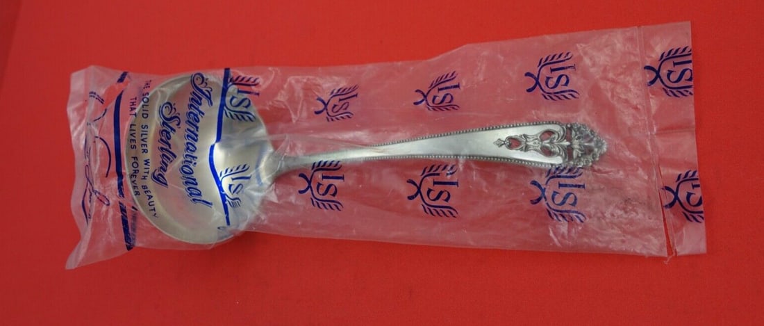 International Sterling Silver Queens Lace Gravy Ladle 6.5" Factory Sealed: International Sterling Silver Queens Lace Gravy Ladle 6.5" Factory Sealed This exquisite gravy ladle features the elegant Queens Lace pattern by International Sterling. Crafted from high-quality sterl