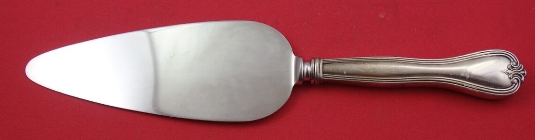 Amston Puritan Sterling Silver Cake Server 10 inch Hollow Handle: Amston Puritan Sterling Silver Cake Server 10 inch Hollow Handle This elegant Puritan cake server by Amston is crafted from sterling silver, featuring a hollow handle and a stainless steel implement.