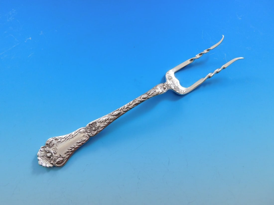 Gorham Poppy Sterling Silver Custom Baked Potato Fork 7": Gorham Poppy Sterling Silver Custom Baked Potato Fork 7" This exquisite 7" baked potato fork is crafted from sterling silver and features the elegant Poppy pattern by Gorham. Produced between 1900 and