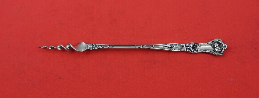 Wallace Peony Sterling Silver Twisted Butter Pick 5 3/4 inches: Wallace Peony Sterling Silver Twisted Butter Pick 5 3/4 inches Introducing the Peony Butter Pick by Wallace, a beautifully crafted serving piece made of sterling silver. This pick features a twisted d