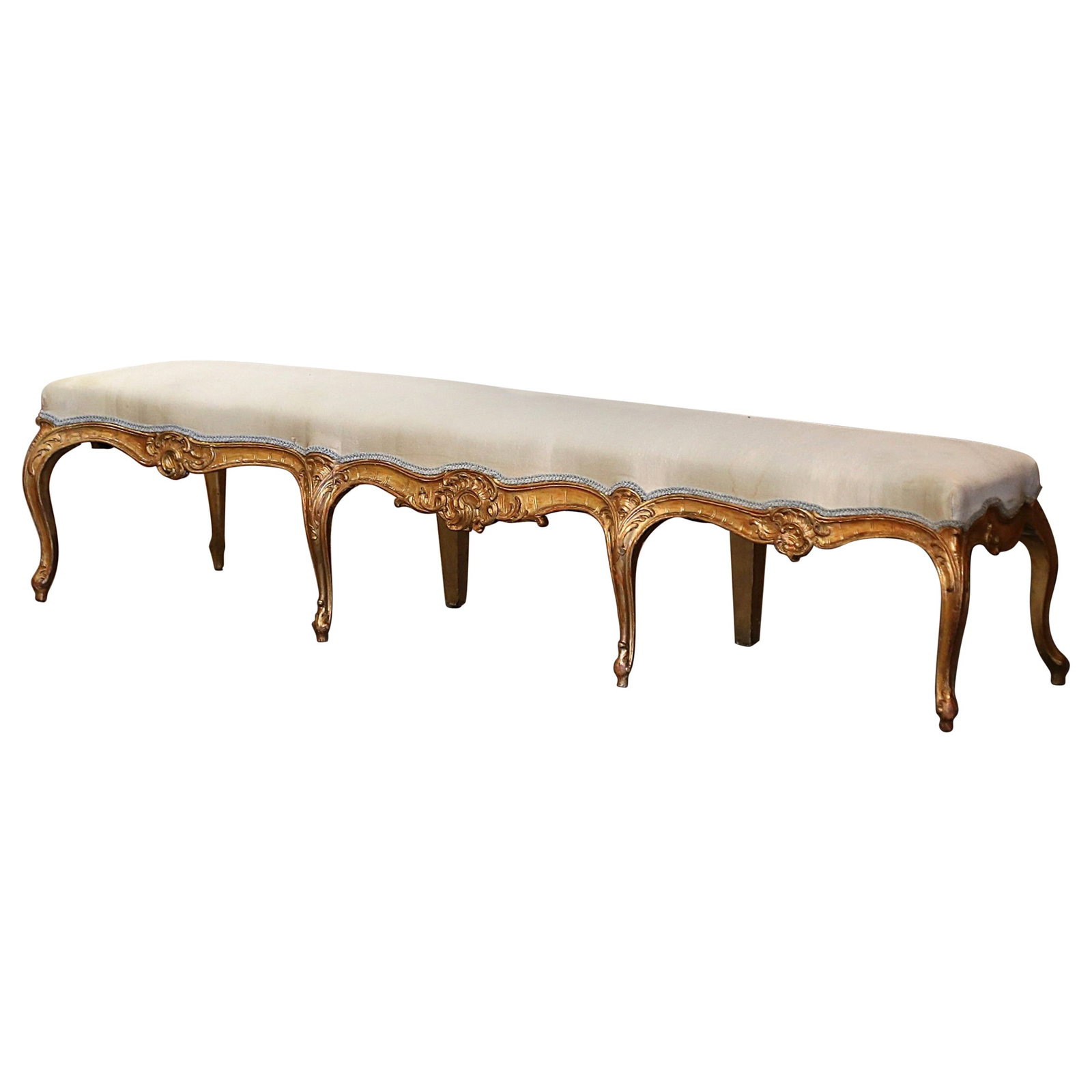 19th Century French Louis XV Hand-Carved Giltwood Upholstered Bench: 19th Century French Louis XV Hand-Carved Giltwood Upholstered Bench Introducing a stunning 19th Century French Louis XV Carved Giltwood Upholstered Eight-Leg Bench, a perfect blend of comfort and eleg