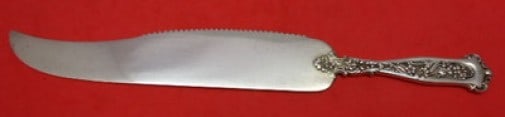 Whiting Sterling Silver Dresden Cake Saw 9 1/4 Inch Serrated: Whiting Sterling Silver Dresden Cake Saw 9 1/4 Inch Serrated This exquisite cake saw, crafted by Whiting, showcases the elegant Dresden pattern and is made of high-quality sterling silver. Measuring 9