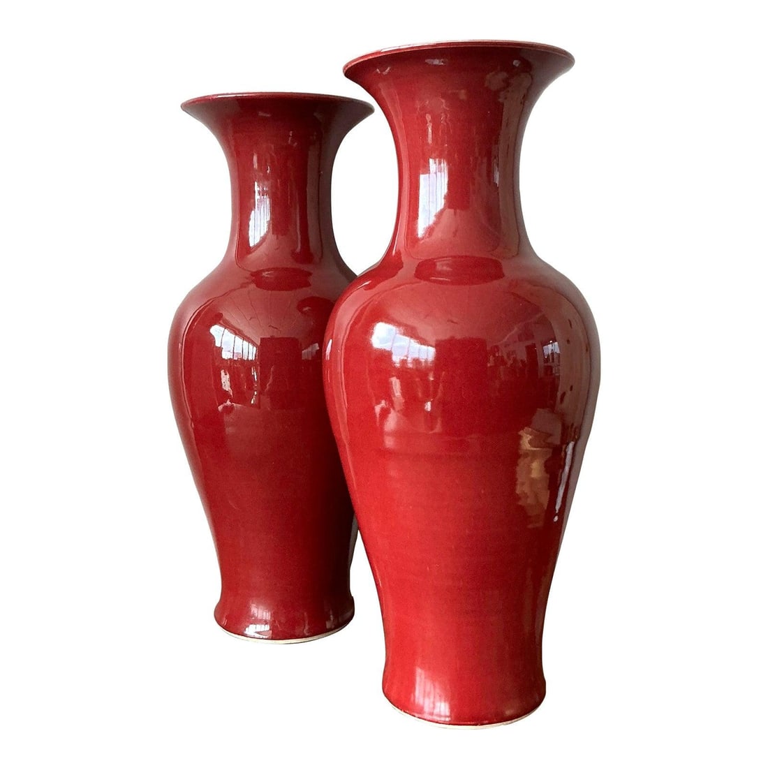 Pair of Asian Sang de Boeuf Glazed Ceramic Vases: Pair of Asian Sang de Boeuf Glazed Ceramic Vases This is a pair of vintage Asian glazed ceramic vases, each finished with the renowned "Sang de Boeuf" (oxblood) glaze. The vases display a deep brick r